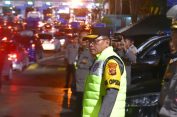 Berhujan demi Kelancaran Arus Balik : Potret Kesigapan Polisi di Pelabuhan Bakauheni